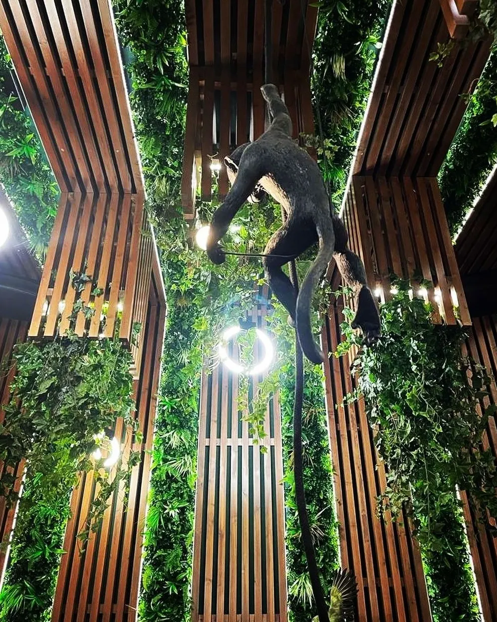 A beautifully crafted artificial green wall featuring lush greenery, stylish decorative elements, and a modern aesthetic, designed by Fairy Tale Green Walls in Limassol, Cyprus.